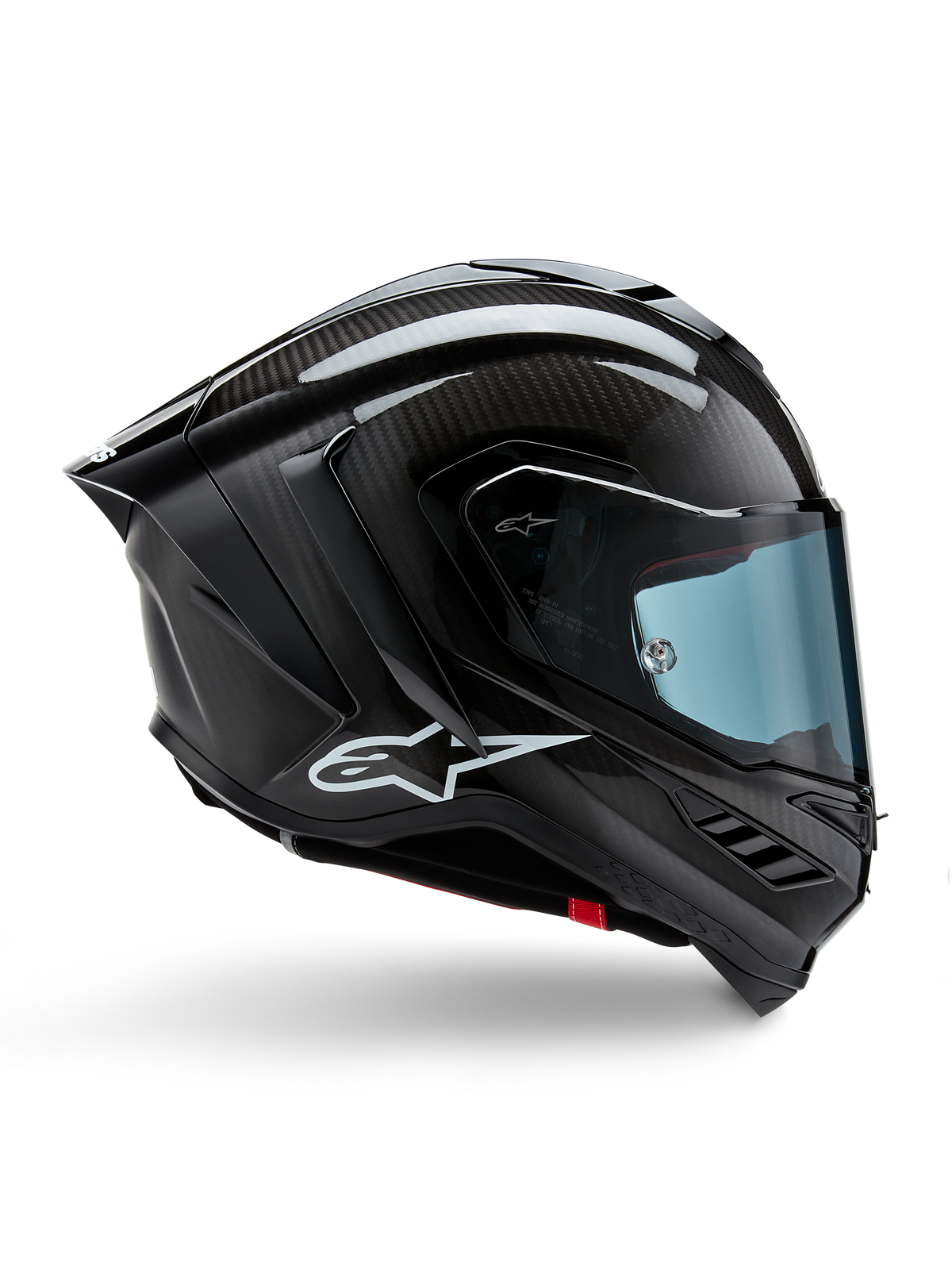Casco Alpinestars Supertech R10 Solid, carbonio nero opaco e lucido, casco da moto racing, costruzione in fibra di carbonio, profilo laterale, visiera blu, design aerodinamico con alette, logo bianco, protezione ad alte prestazioni di livello MotoGP