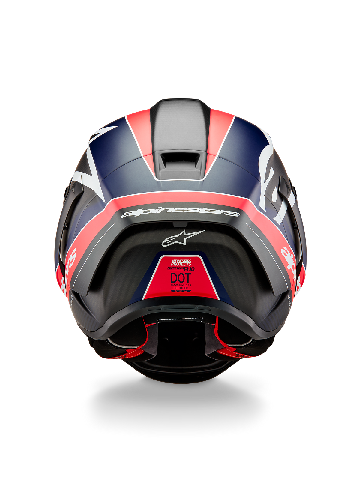 Casco Alpinestars Supertech R10 Team, vista posteriore, carbonio nero con accenti rosso fluo e blu opaco, con spoiler aerodinamico, logo Alpinestars bianco in evidenza ed etichetta di certificazione DOT, equipaggiamento professionale da motorsport