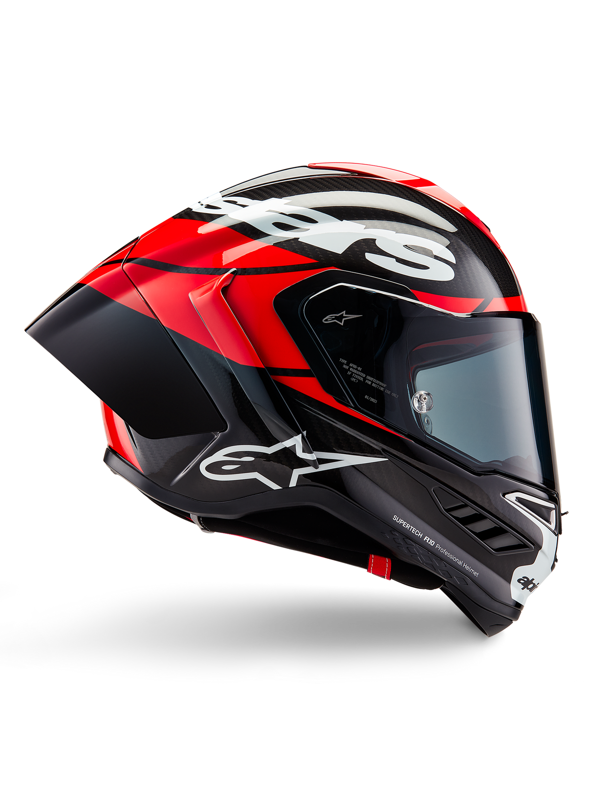 Casco Alpinestars Supertech R10 Element, casco integrale da moto racing, carbonio nero con dettagli rosso brillante e bianchi, profilo laterale che mostra la calotta aerodinamica in fibra di carbonio, finitura lucida con logo bianco, visiera fumé, protezione professionale per le competizioni