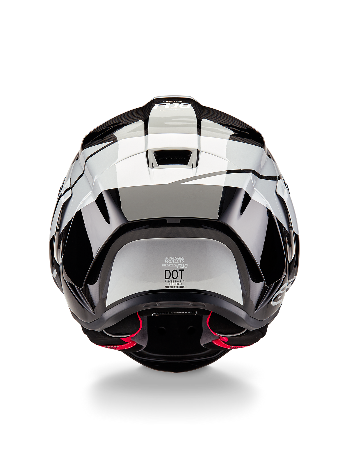 Casco Alpinestars Supertech R10 Element, vista posteriore, nero carbonio argento e nero lucido, con design dello spoiler aerodinamico, etichetta di certificazione DOT e accenti rossi nell'imbottitura interna, protezione per la testa professionale da corsa