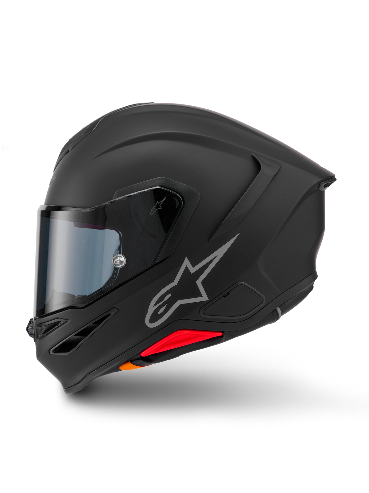 Casco Alpinestars S-R7 Solid, casco integrale da moto, nero opaco, vista laterale, con logo Astars argentato sul lato, design aerodinamico con spoiler integrato e prese d'aria sulla mentoniera, e accenti rossi e arancioni alla base.