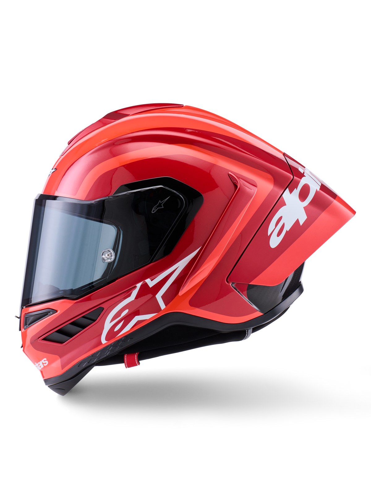 Casco Alpinestars Supertech R10 Arius, casco integrale racing, rosso lucido con grafiche logo bianche, vista laterale di profilo che evidenzia lo spoiler aerodinamico e la visiera trasparente, calotta in composito di fibra di carbonio per il motorsport professionale