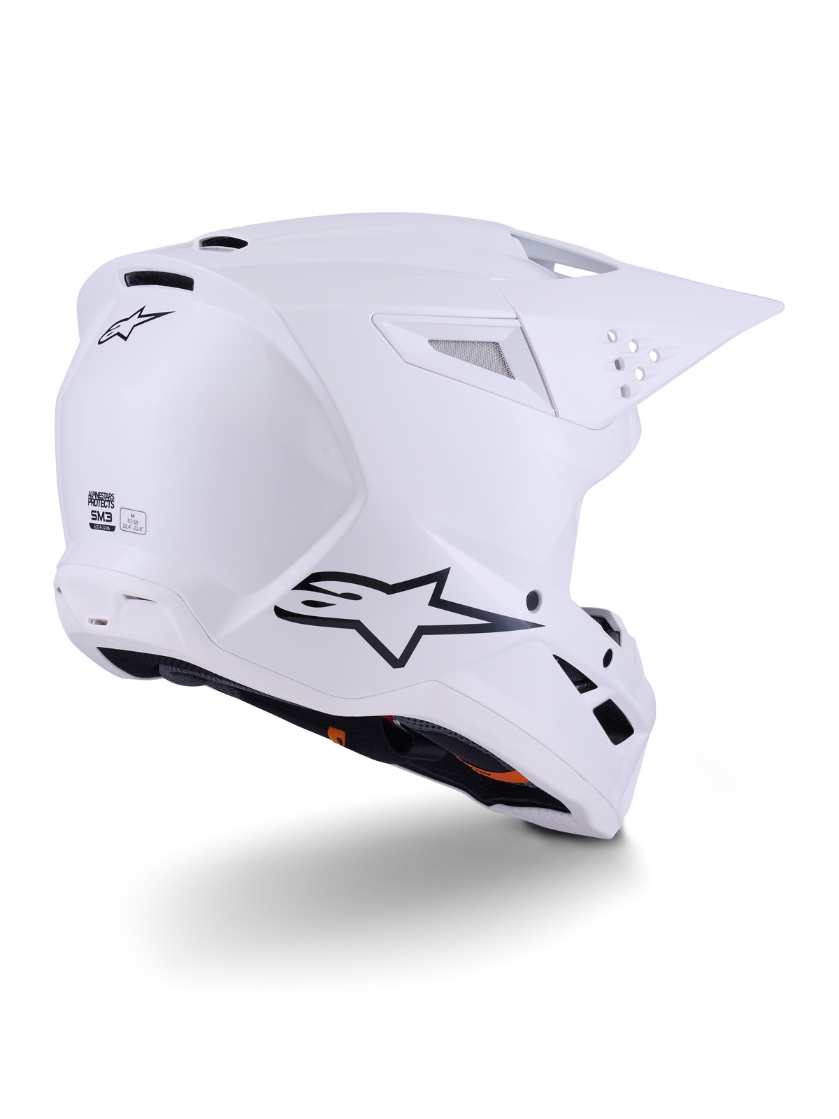 Casco Alpinestars S-M3 Solid, casco da motocross, bianco lucido, vista posteriore a tre quarti che mostra il logo Alpinestars nero, prese d'aria e design aerodinamico della calotta per gare off-road