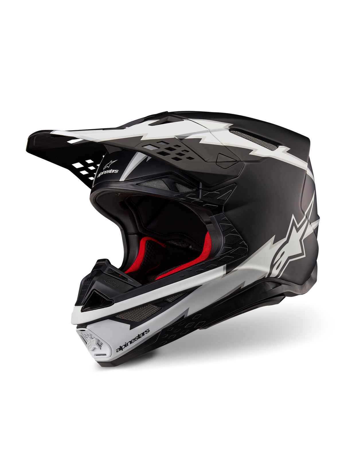 Casco Alpinestars Supertech M10 Ampress, casco da motocross, nero opaco e bianco, con grafiche bianche a forma di fulmine e loghi a stella, fodera interna rossa, calotta in carbonio multi-composito con profilo aerodinamico snello
