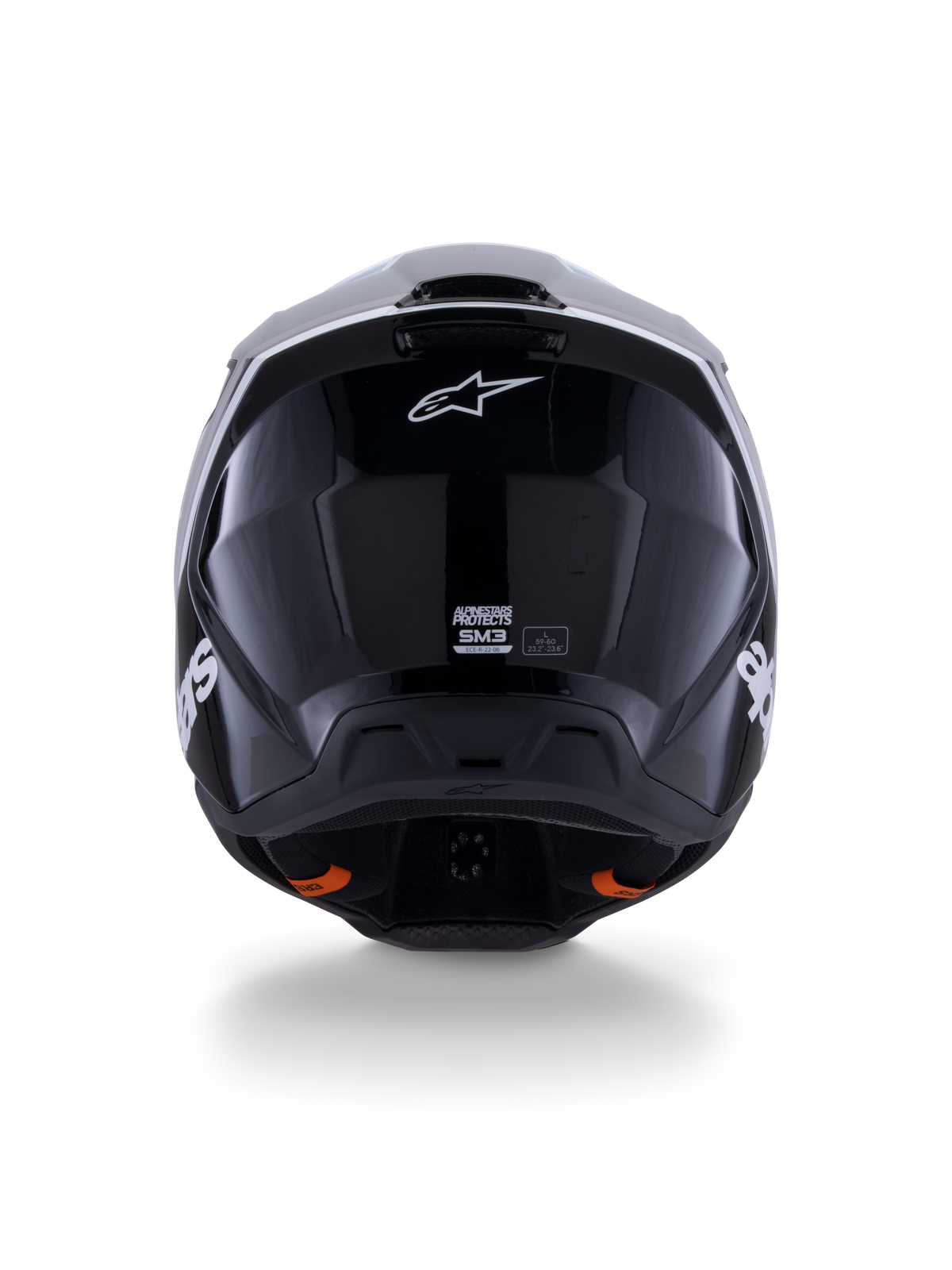 Casco Alpinestars S-M3 Radium ECE 22.06, casco da motocross, nero bianco grigio lucido, vista posteriore che mostra la finitura nera lucida, logo Alpinestars a stella, porte di scarico della ventilazione ed etichetta di certificazione ECE.