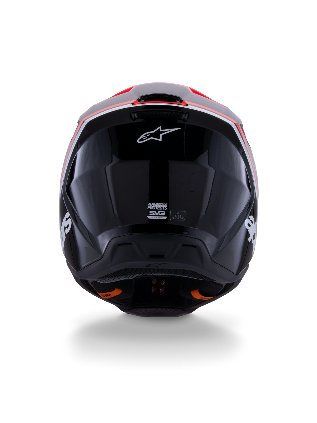 Alpinestars S-M3 Radium Helmet ECE 22.06, casco da motocross, nero lucido con accenti rosso fluo e bianchi, vista posteriore che mostra il design aerodinamico della calotta, logo a stella bianco ed etichette di certificazione.