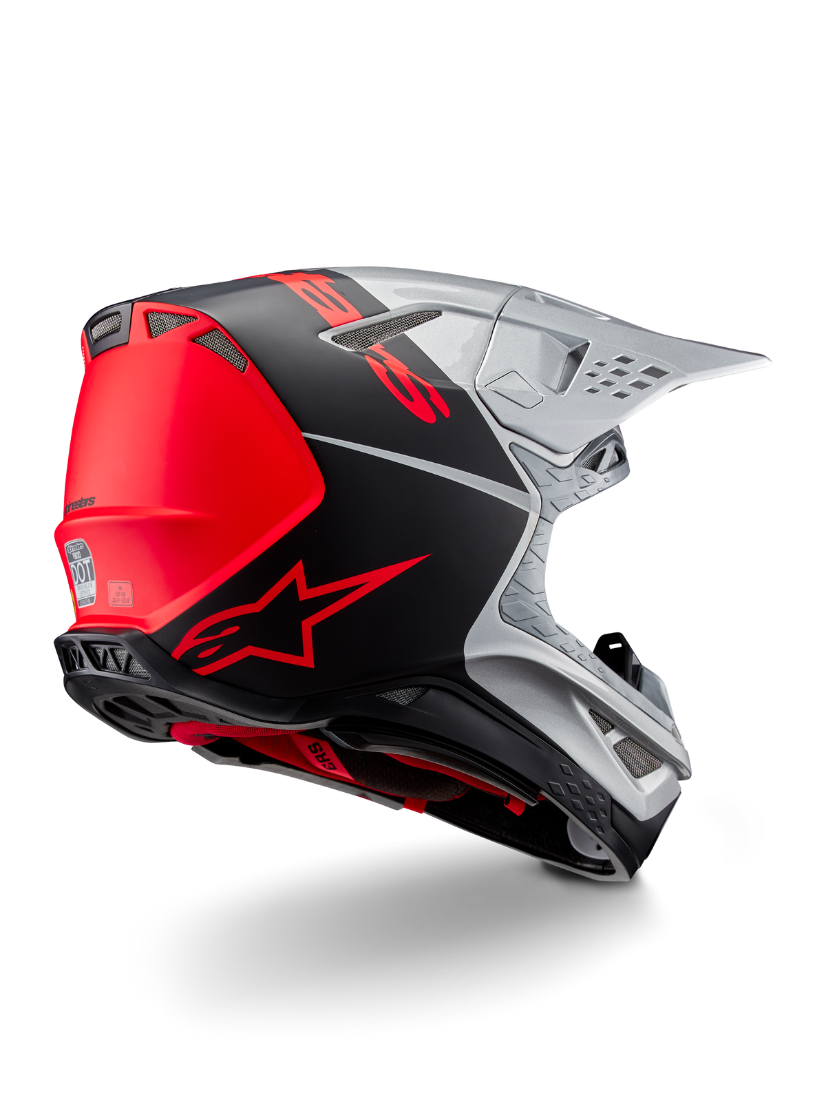Casco Alpinestars Supertech M10 Flood ECE 22.06, casco da motocross, argento, nero e arancione fluo, vista laterale posteriore che evidenzia il design aerodinamico della calotta, le prese di ventilazione e la finitura opaca-lucida