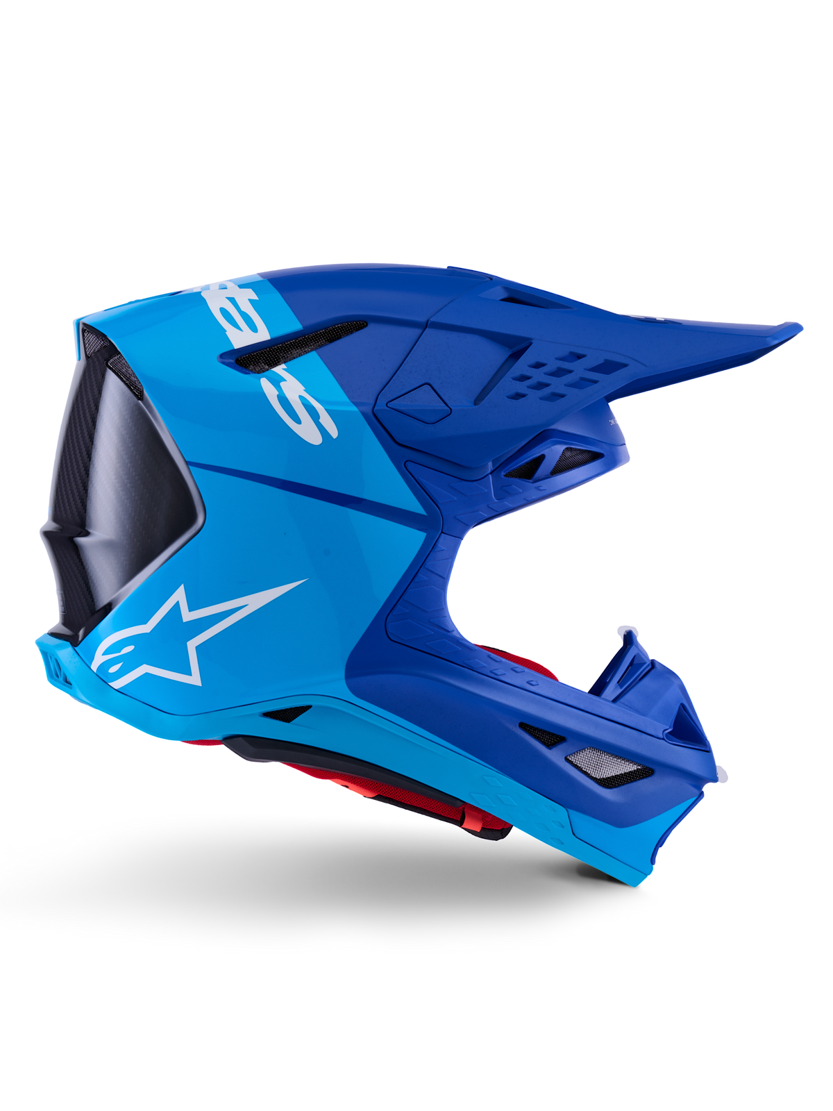 Casco Alpinestars Supertech M10 Flood, casco da motocross, blu metallizzato e blu medio con accenti in carbonio nero, vista laterale, con logo bianco, design aerodinamico con prese di ventilazione, dettagli in fibra di carbonio, protezione professionale per competizioni fuoristrada