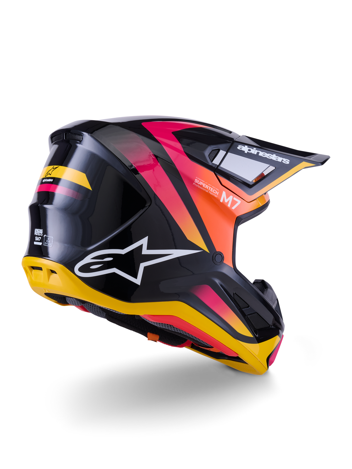 Casco Alpinestars S-M7 Rise, casco da motocross, nero, giallo e rosa lucido, vista posteriore e laterale con calotta aerodinamica in materiale composito, sfumature vivaci, loghi evidenti e prese d'aria