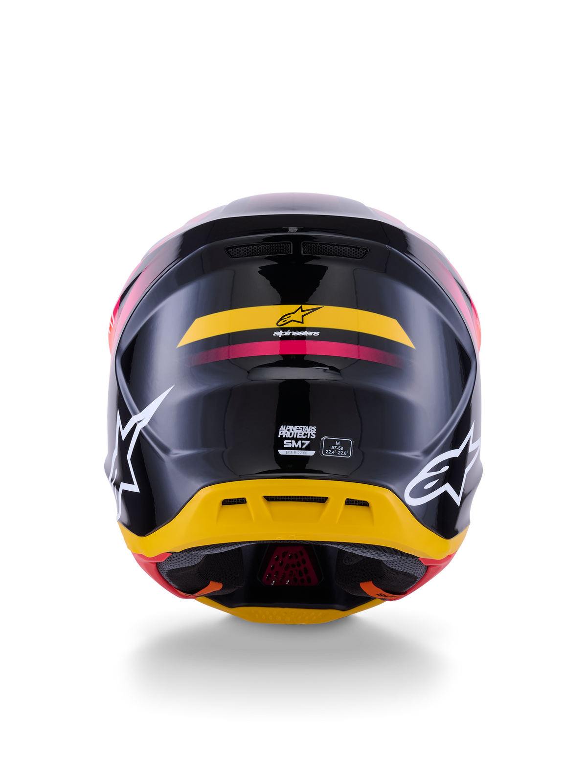 Alpinestars S-M7 Rise Helmet ECE 22.06, casco da motocross, vista posteriore, nero lucido con accenti gialli e rosa, grandi loghi bianchi sui lati, calotta aerodinamica in materiale composito, equipaggiamento da gara off-road