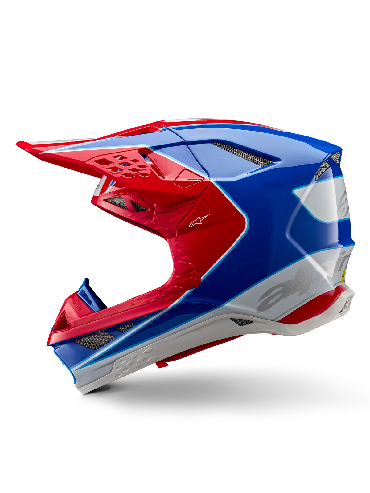 Casco Alpinestars Supertech M10 Aeon ECE 22.06, casco da motocross, rosso e blu lucido, vista di profilo laterale, calotta multi-composita aerodinamica con prese d'aria integrate e design grafico rosso e blu, finitura lucida per gare fuoristrada