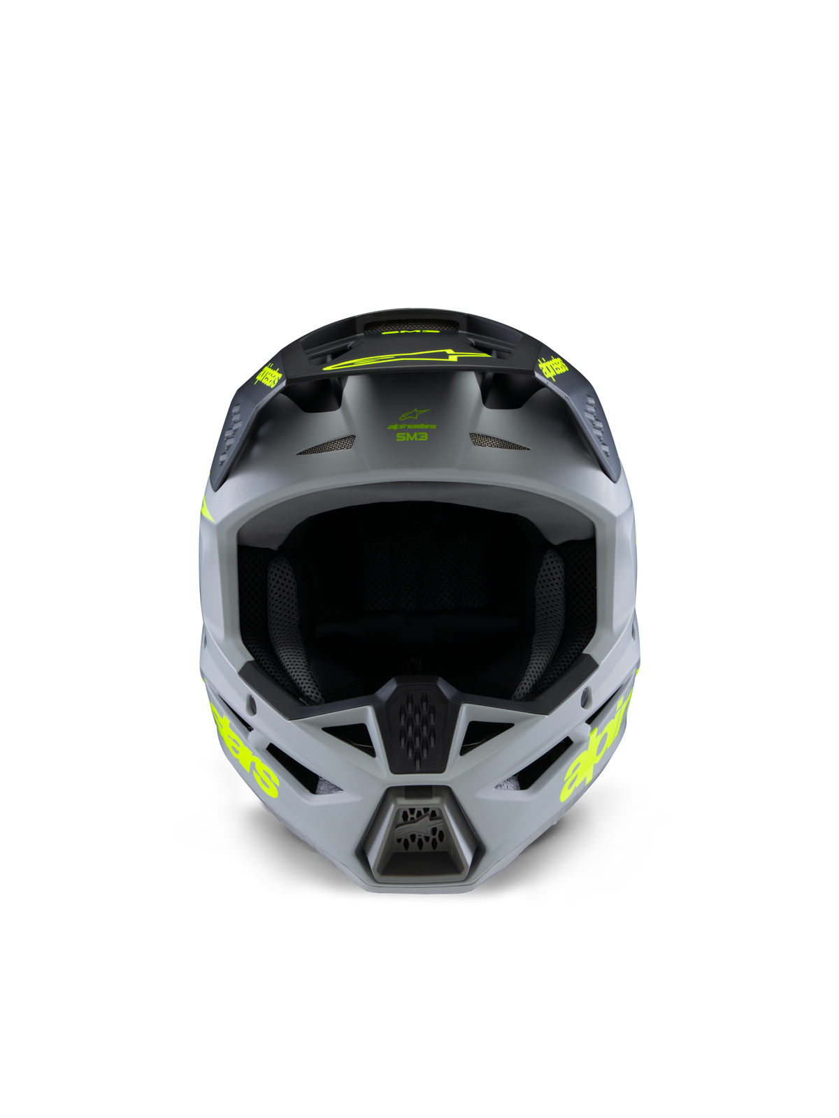 Casco Alpinestars S-M3 Youth Radium, casco da motocross, grigio, nero e giallo fluo opaco, vista frontale con calotta angolare aggressiva, loghi gialli vivaci sui lati e sul frontino, finitura opaca progettata per fuoristrada e competizioni MX per ragazzi.