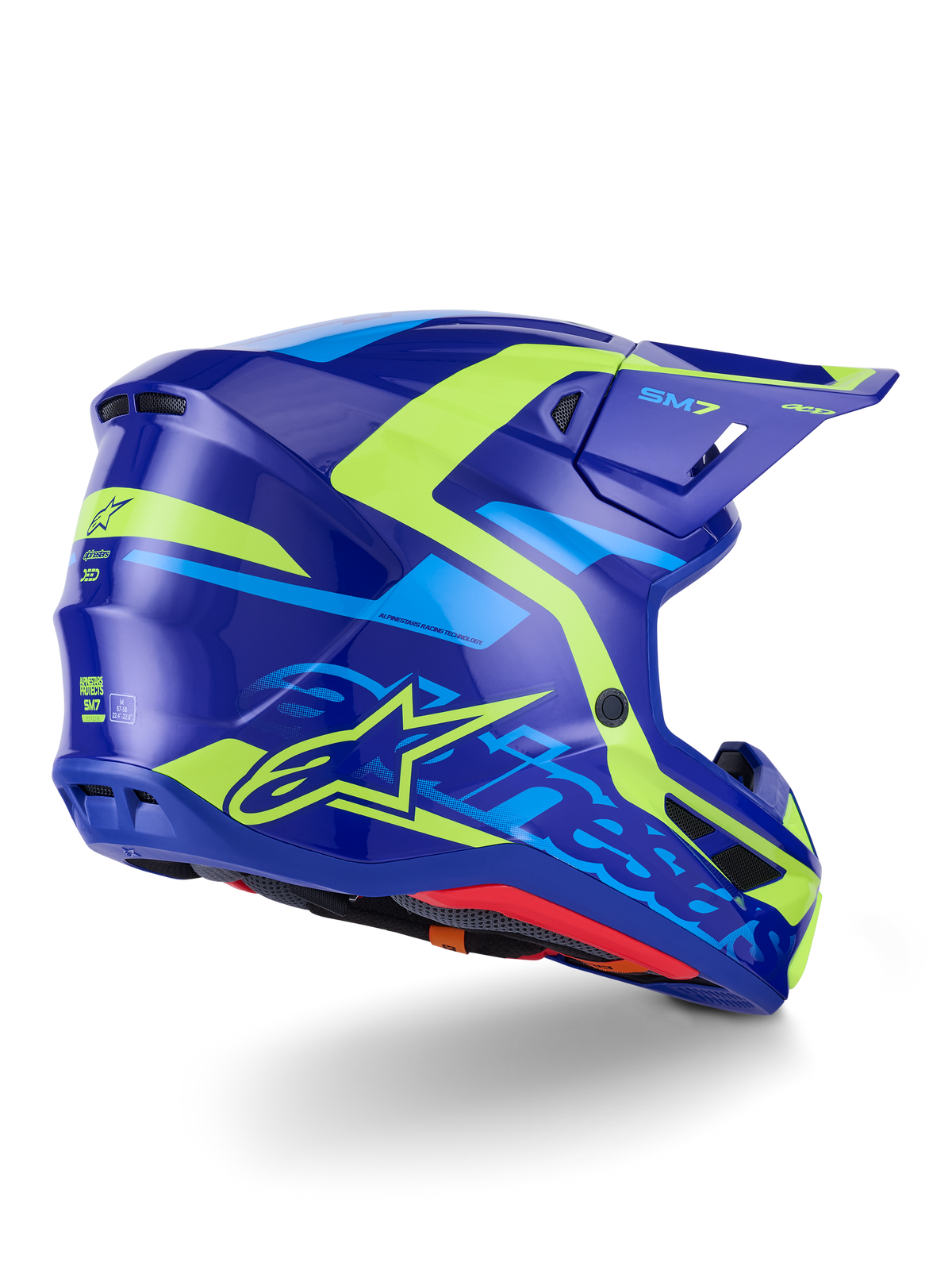 Alpinestars S-M7 Deed Helmet ECE 22.06, casco da motocross, blu e giallo fluo lucido, vista laterale-posteriore caratterizzata da un profilo della calotta aerodinamico, branding Alpinestars con vivaci accenti giallo neon, prese d'aria ad alte prestazioni e finitura lucida per competizioni off-road.