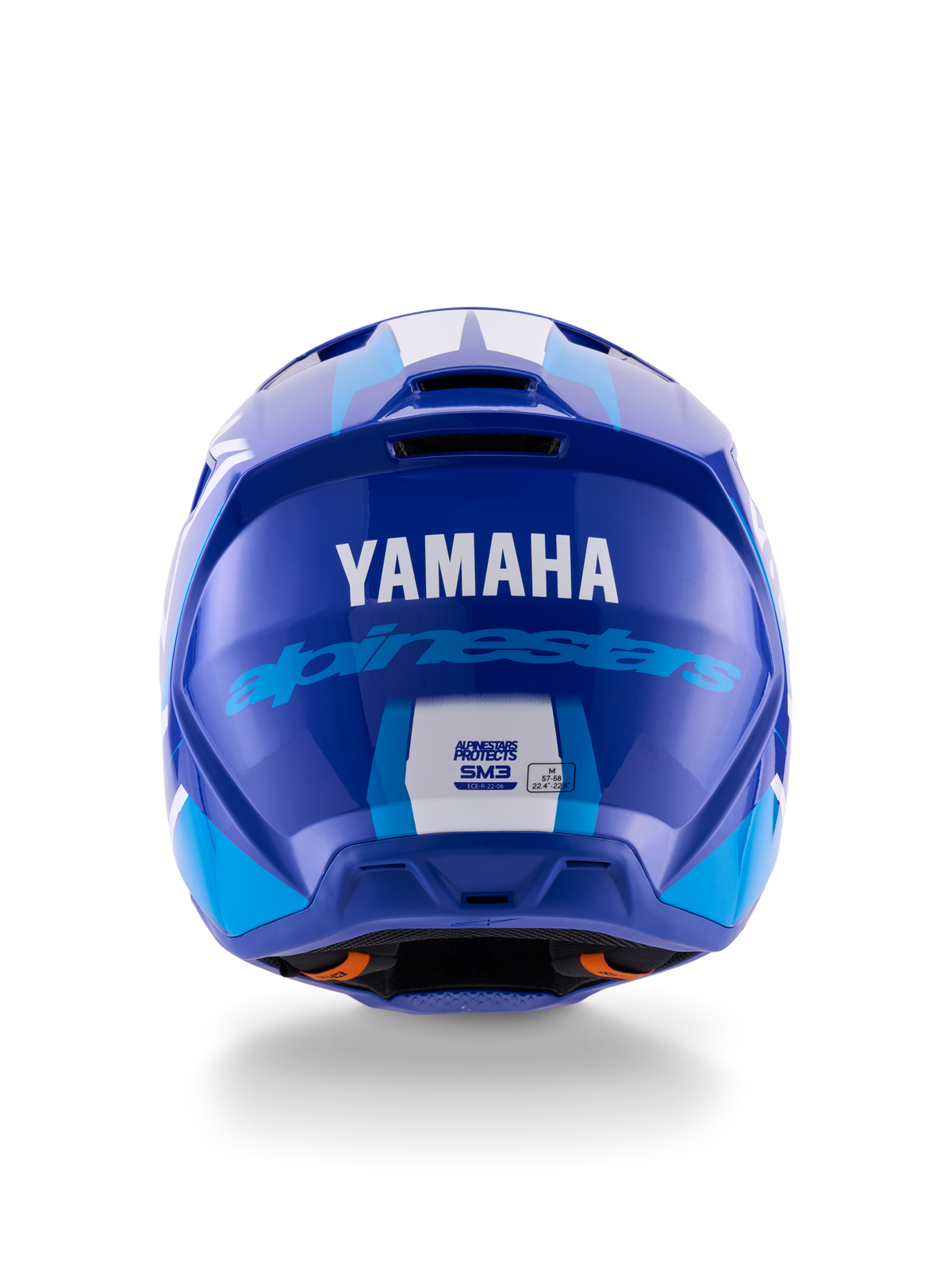 Casco Alpinestars Yamaha S-M3, casco da motocross, blu e bianco lucido, vista posteriore con logo YAMAHA bianco e scritta Alpinestars blu, finitura lucida con prese d'aria visibili ed etichette di certificazione di sicurezza