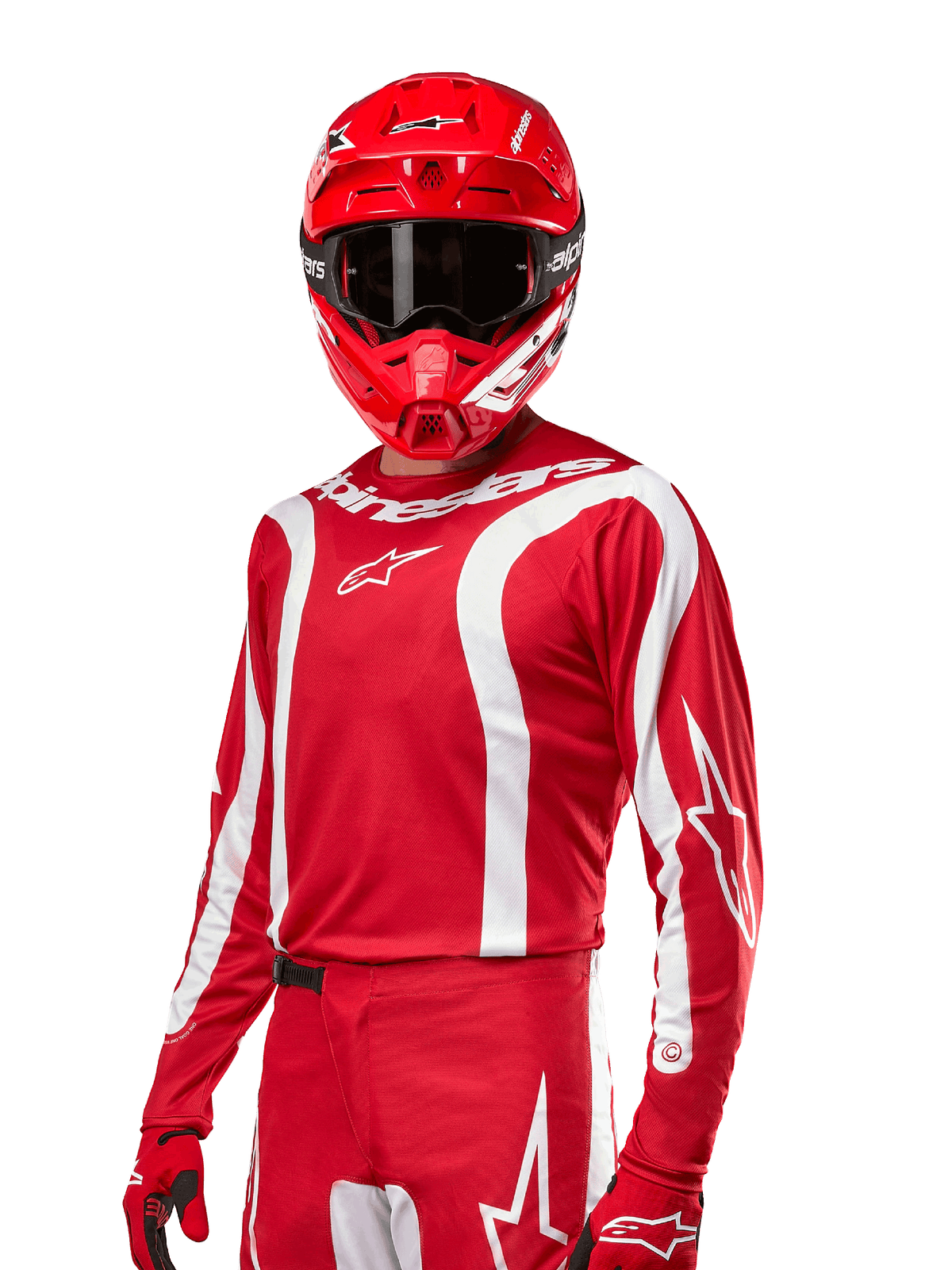 Alpinestars Maglia Fluid Lurv 2024, maglia da motocross, rosso Mars e bianco, indossata con casco e guanti coordinati, design sportivo audace con strisce curve bianche e marchio Alpinestars
