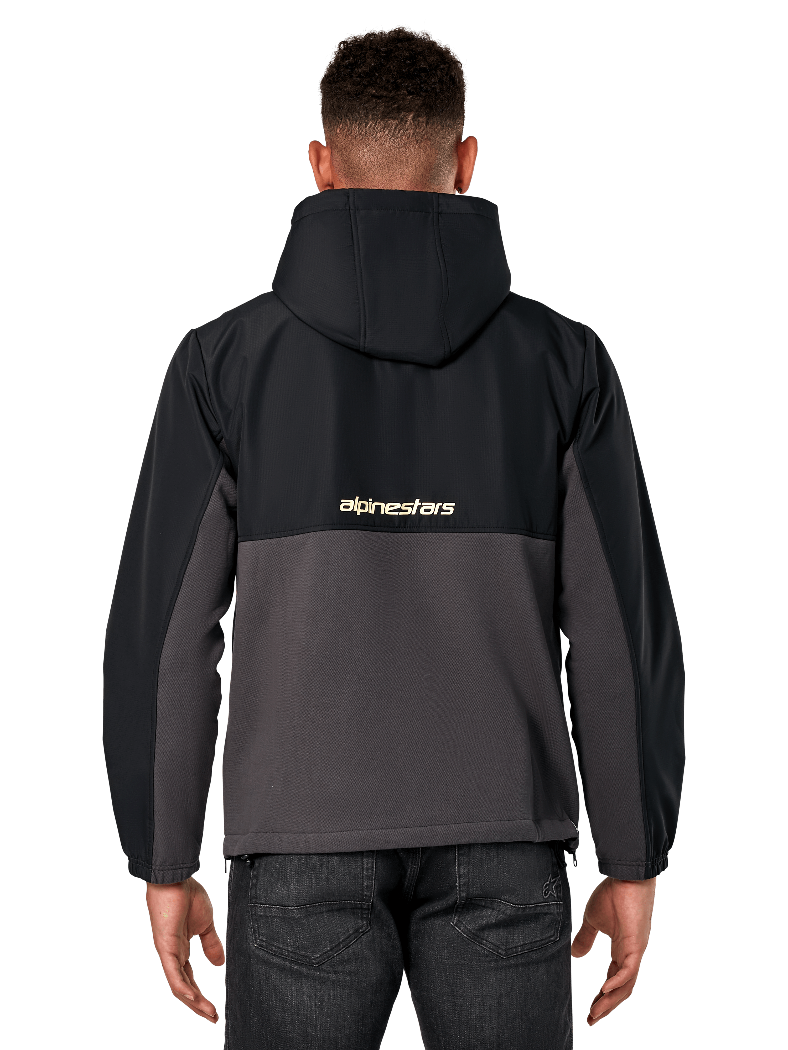 Giacca Alpinestars Juncture Hybrid, vista posteriore, Nero e Gunmetal, anorak casual sportswear con costruzione in materiali misti, parte superiore in ripstop e parte inferiore in pile di tela, logo Alpinestars sul retro, indossata con pantaloni scuri