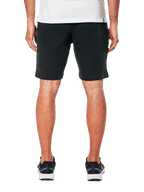 Alpinestars Dunker Short, pantaloncini da allenamento in pile, nero, vista posteriore con tasca a filo, design sportivo e casual, indossati con t-shirt bianca e scarpe sportive nere