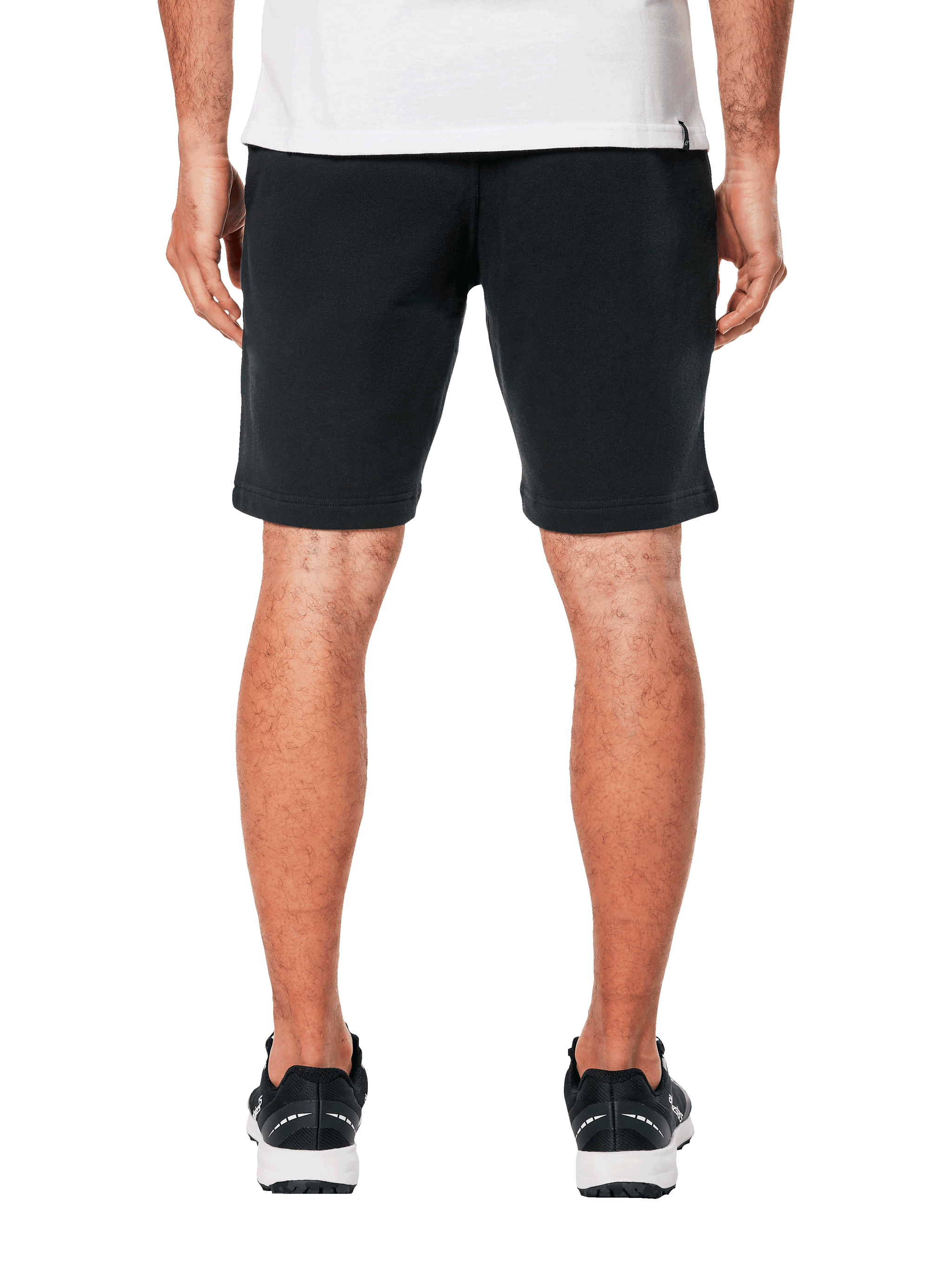 Alpinestars Dunker Short, pantaloncini da allenamento in pile, nero, vista posteriore con tasca a filo, design sportivo e casual, indossati con t-shirt bianca e scarpe sportive nere