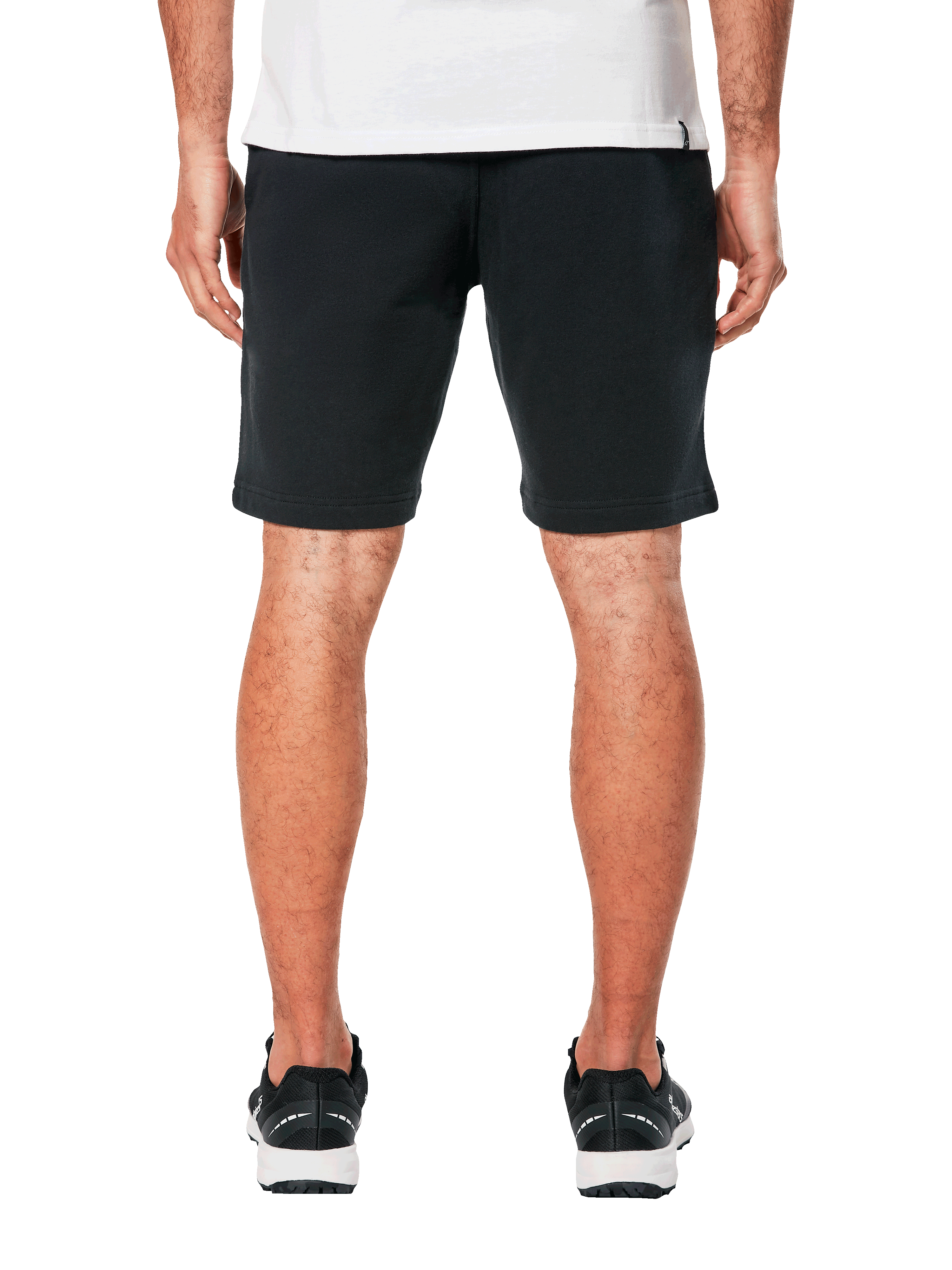Alpinestars Dunker Short, pantaloncini da allenamento in pile, nero, vista posteriore con tasca a filo, design sportivo e casual, indossati con t-shirt bianca e scarpe sportive nere