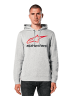 Alpinestars Always V3 Hoodie, felpa grigio chiaro melange con logo a stella rosso e nero, indossata da un modello, streetwear casual, cappuccio con cordino, tasca a marsupio frontale, design ispirato al motorsport