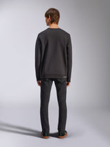 Alpinestars Positive Crew, Black Pullover Sweatshirt, back view on male model, worn with black jeans and casual sneakers, featuring ribbed cuffs and hem, motorsport-inspired streetwear