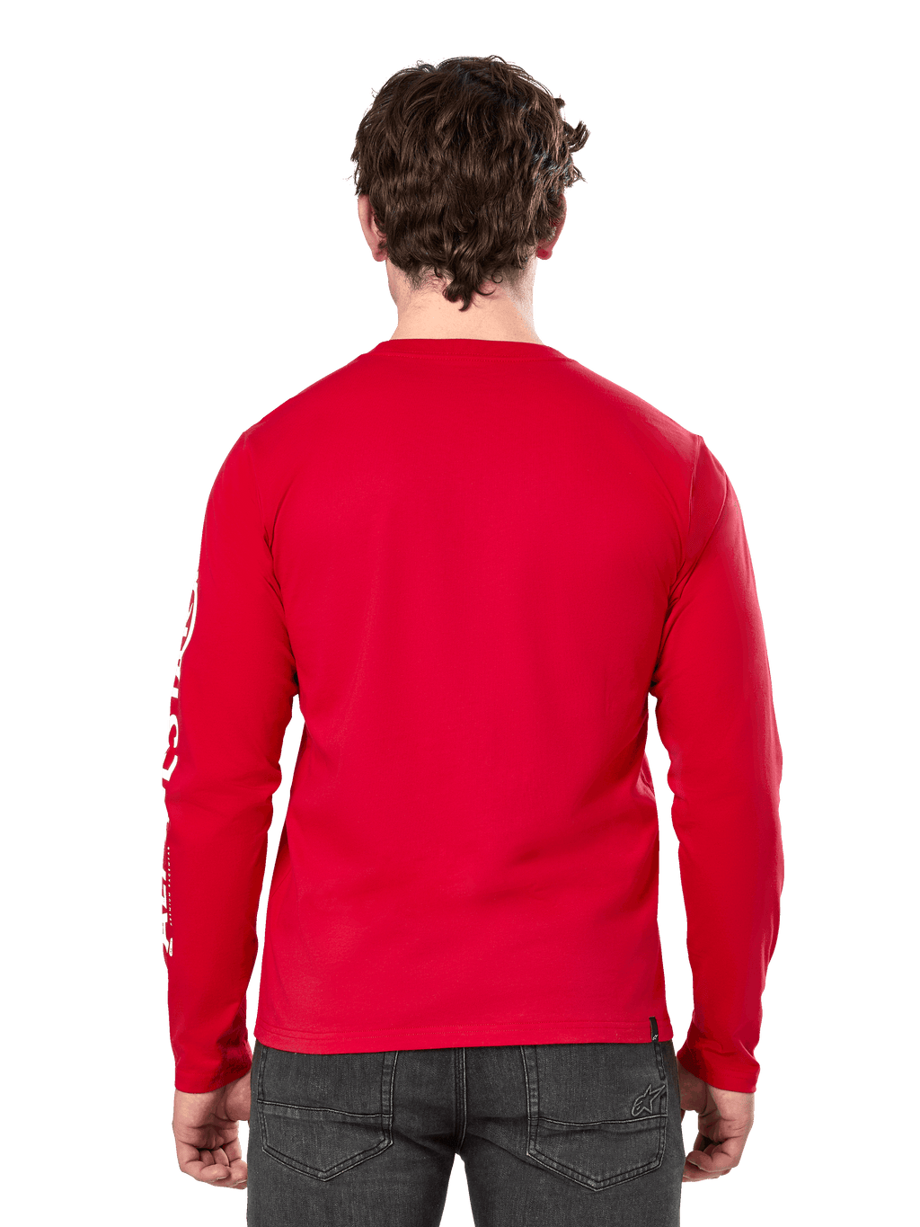 Vista posteriore di un uomo che indossa la t-shirt a maniche lunghe Alpinestars Committed CSF in rosso, abbinata a jeans grigio scuro, con logo Alpinestars bianco visibile sulla manica e un design posteriore minimalista.
