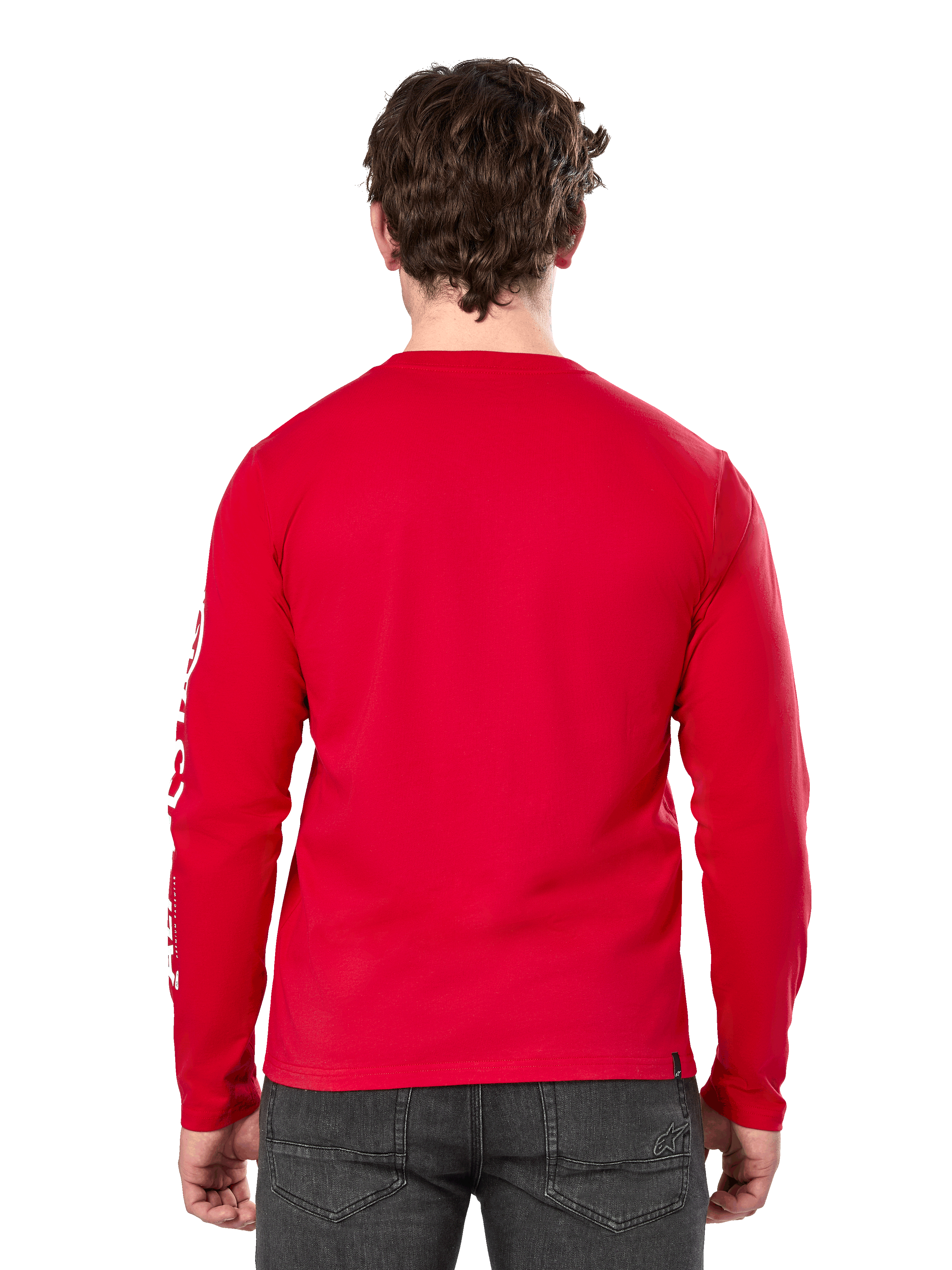 Vista posteriore di un uomo che indossa la t-shirt a maniche lunghe Alpinestars Committed CSF in rosso, abbinata a jeans grigio scuro, con logo Alpinestars bianco visibile sulla manica e un design posteriore minimalista.
