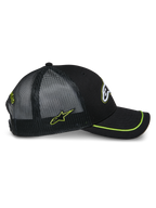 Cappello Trucker Alpinestars Exceed, vista laterale, nero con accenti verde lime, pannelli posteriori in rete, visiera curva con bordo sutache verde lime, logo laterale ricamato, copricapo casual motorsport