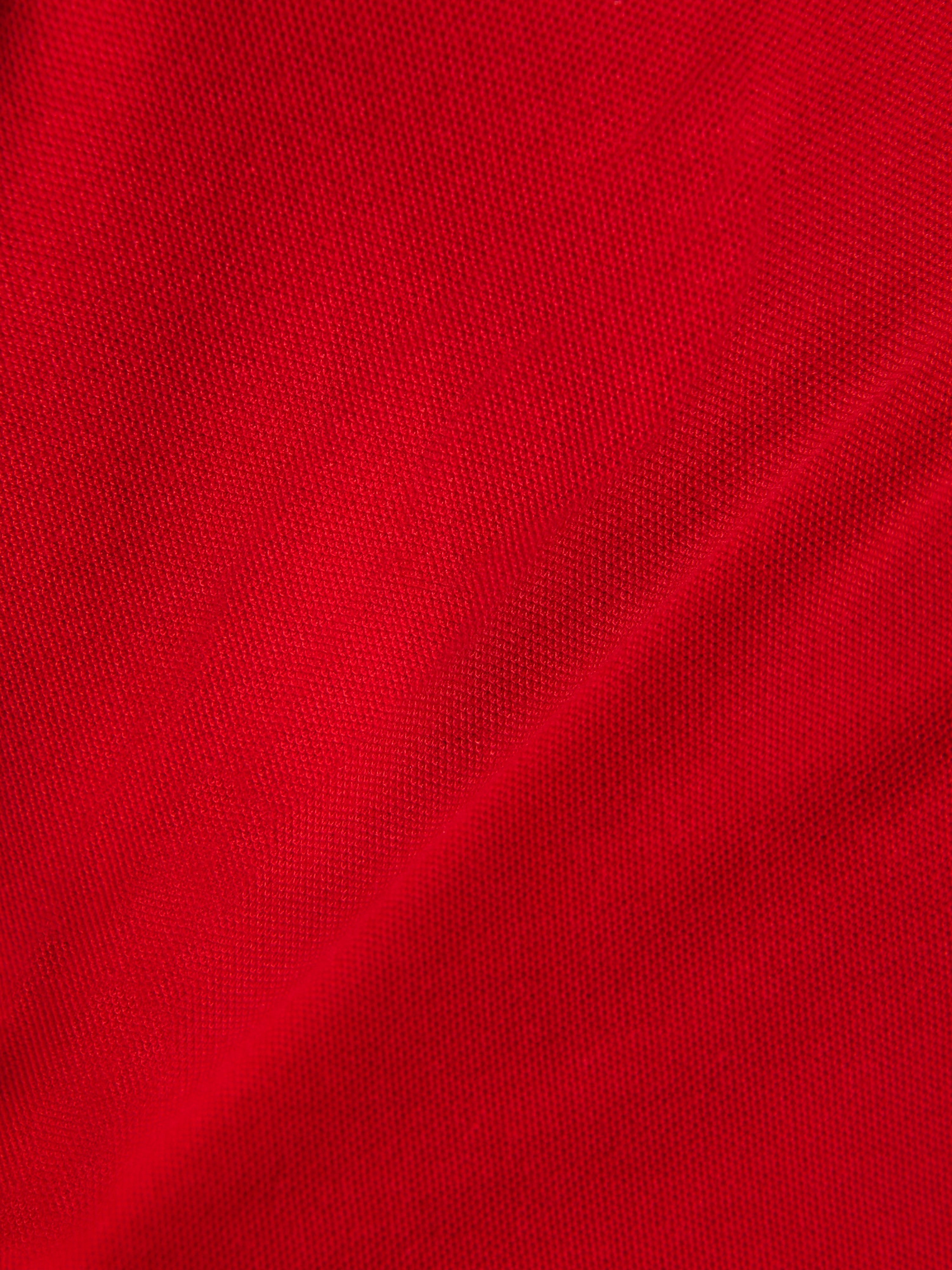 Alpinestars Endeavor Classic Polo, dettaglio del tessuto piqué rosso, materiale in maglia testurizzata, misto cotone-poliestere, abbigliamento sportivo casual motorsport