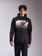 Alpinestars Obsessed Hoodie, abbigliamento sportivo casual, pullover nero con grande logo Astars frontale, sfumatura MX punteggiata in bianco e nero, branding rosso sulle maniche, cappuccio con cordino e polsini a coste