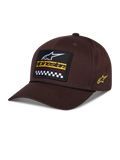 Cappello Matrix Snapback Alpinestars, marrone, con toppa frontale ricamata con logo bianco, marchio giallo e motivo a scacchi, logo Astars laterale, visiera curva, abbigliamento sportivo casual
