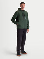 Alpinestars Giacca frangivento Speeder Resolve, giacca con cappuccio da uomo verde pino, leggera per uso urban e sportswear, costruzione in poliestere con fodera in rete e loghi Alpinestars sul petto.