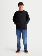 Alpinestars Guise Oversized Crew, felpa girocollo sportswear nera, modello unisex vestibilità oversize con tasca a marsupio e loghi ricamati, in cotone e poliestere riciclato.