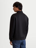 Alpinestars Felpa Apera Half-Zip, pullover sportswear da uomo, nero, vista posteriore su modello che mostra le cuciture raffinate e la vestibilità lifestyle, costruzione in pile tri-blend premium.