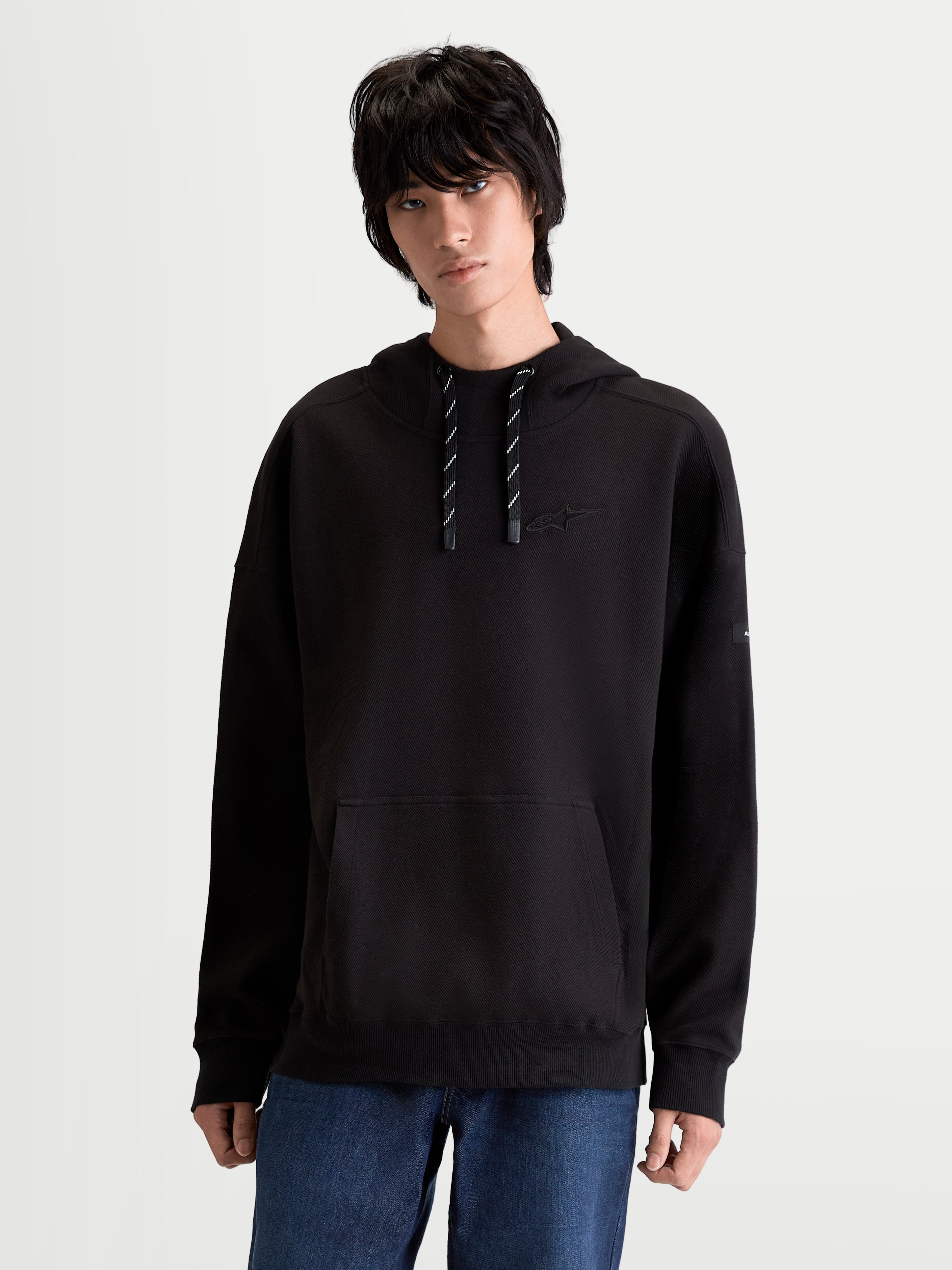 Alpinestars Felpa con cappuccio Camino Textured Oversize, felpa sportswear lifestyle unisex, nera, con collo alto, tasca a marsupio e logo ricamato in tinta, in pile di twill testurizzato.