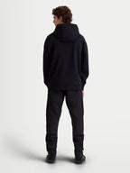 Alpinestars Felpa con cappuccio Shaw Oversize, pullover sportswear casual nero, vista posteriore a figura intera su modello, silhouette rilassata con cappuccio foderato e bordi a coste, costruzione in morbido pile
