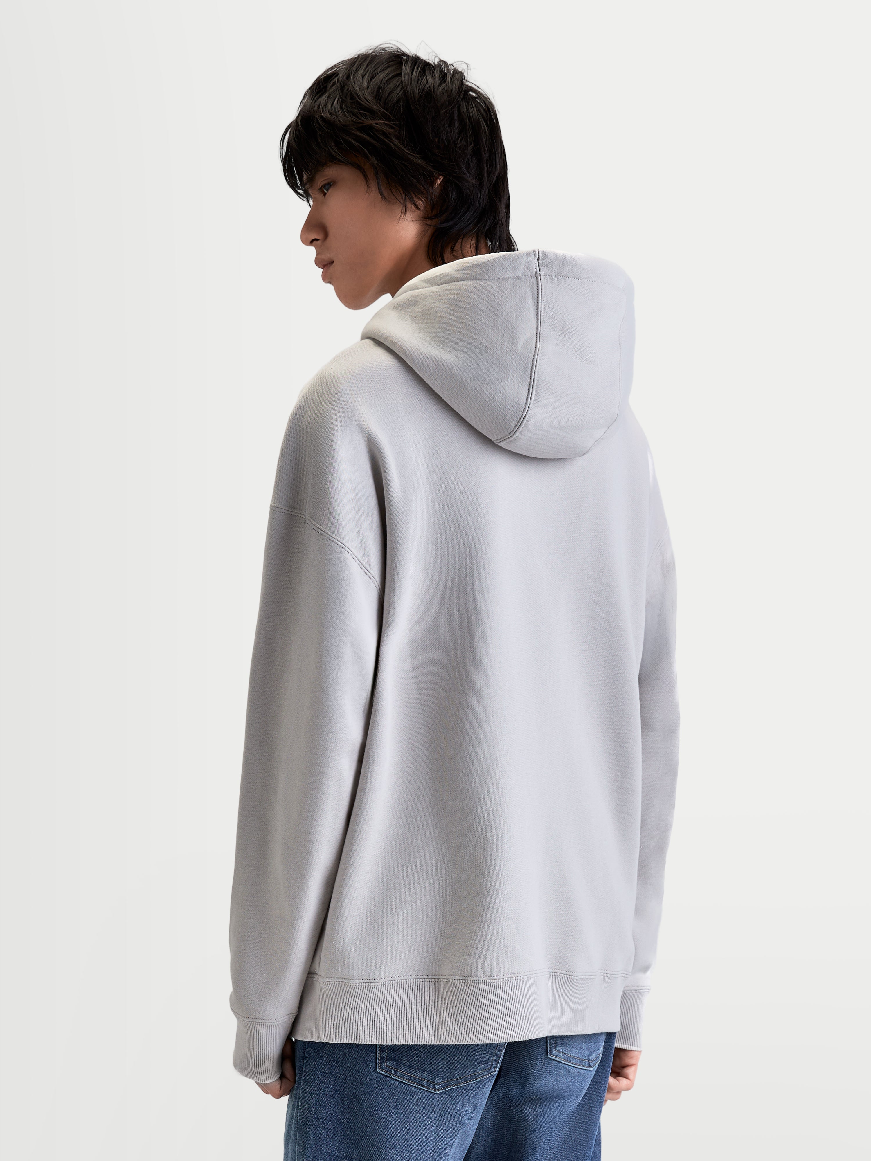 Alpinestars Felpa con cappuccio Prelude Oversized, pullover in pile sportswear per uomo e donna, grigio, silhouette rilassata, cappuccio foderato e cuciture sulle maniche, vista posteriore su modello