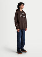 Alpinestars Felpa Con Cappuccio Prelude Oversized, felpa da uomo marrone con vestibilità oversize rilassata, logo bianco con stampa a rilievo sul petto e sulla manica, tasca a marsupio, stile sportswear casual.