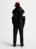 Alpinestars Felpa con cappuccio Cubic, felpa sportswear in pile unisex, nero e bianco, vista posteriore su modello, design color block sulle maniche, abbigliamento casual motorsport in misto cotone.
