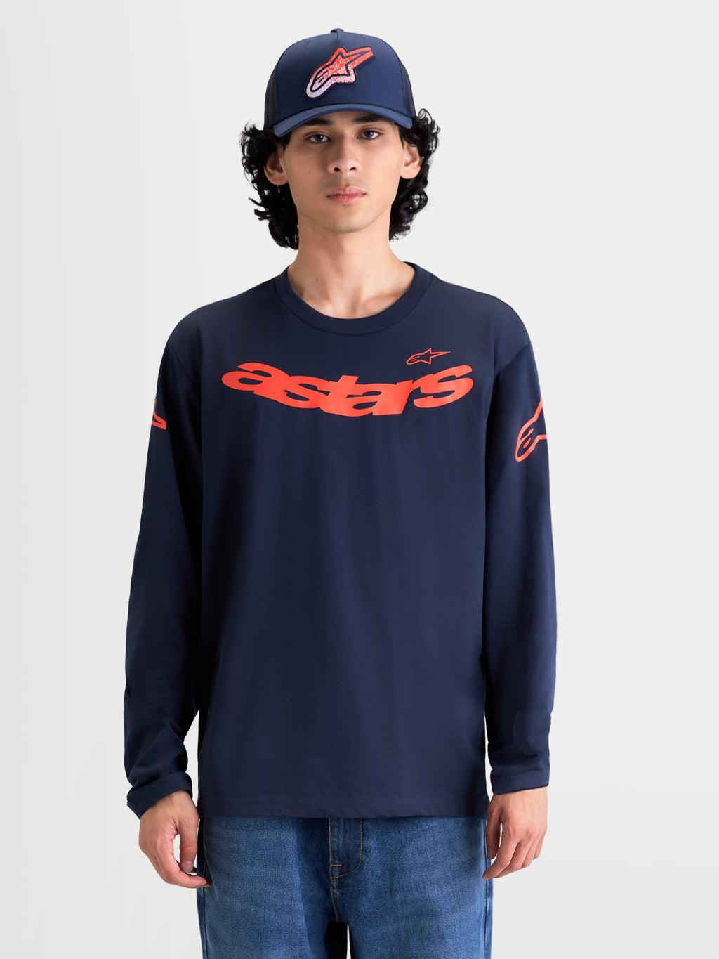 Alpinestars Maglietta Velocifier CSF, maglietta a maniche lunghe da uomo, blu navy e arancione, con grafica Astars curva sul petto e loghi sulle spalle, polsini a coste, tessuto in misto cotone premium, stile sportswear motorsport