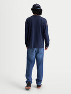 Alpinestars Maglietta Velocifier CSF, maglietta a maniche lunghe, blu navy, vista posteriore su modello con loghi grafici sulle spalle, stile sportswear casual ispirato al motorsport