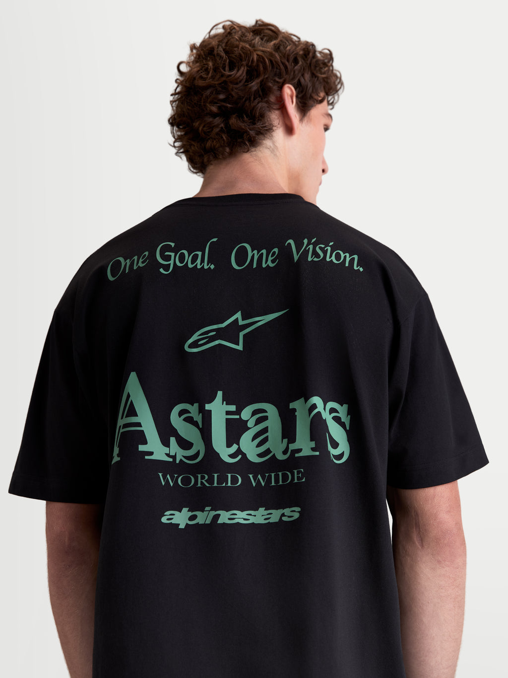 Alpinestars Maglietta Post Oversized CSF, maglietta a maniche corte sportswear, nera e verde, vista posteriore con grafiche One Goal One Vision e logo Astars, vestibilità oversized