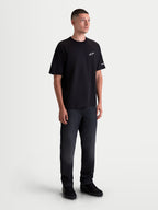 Alpinestars Maglietta Mandate Oversized CSF, maglietta a maniche corte da uomo, nera, vestibilità oversized rilassata, logo Astars bianco in puff print sul petto e grafica sulla manica, stile sportswear casual