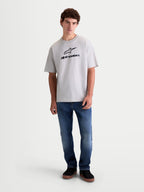 Alpinestars maglietta Prelude Oversized CSF, maglietta da uomo a maniche corte, grigio cemento con logo Astars nero sul petto, fit rilassato in misto cotone e poliestere, stile sportswear casual.