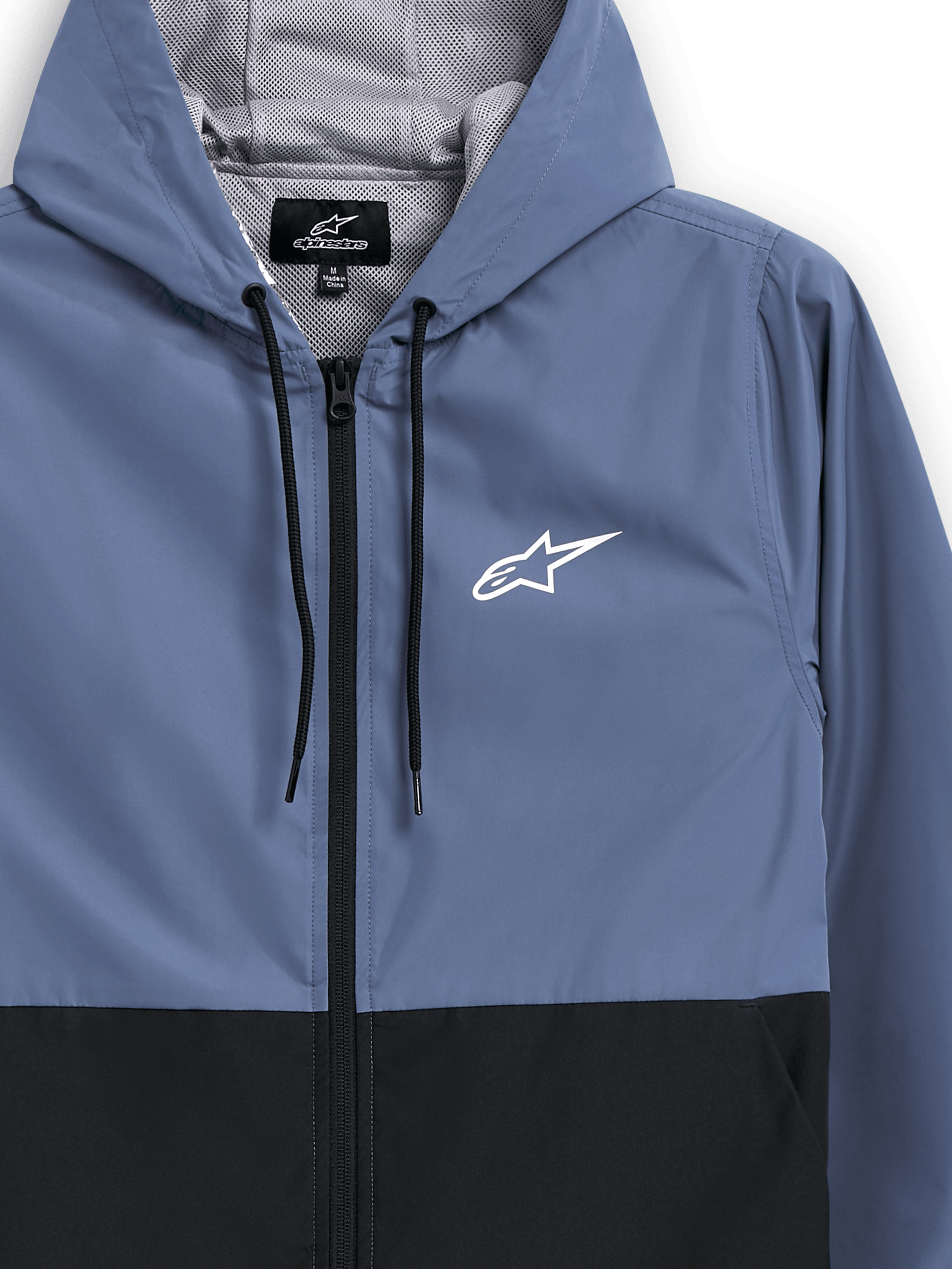 Giacca frangivento Alpinestars Speeder, blu ardesia e nero, giacca a vento leggera con cappuccio, fodera in rete e cordini neri, logo Alpinestars a stella bianco sul petto, design a blocchi di colore, streetwear casual ispirato al motorsport
