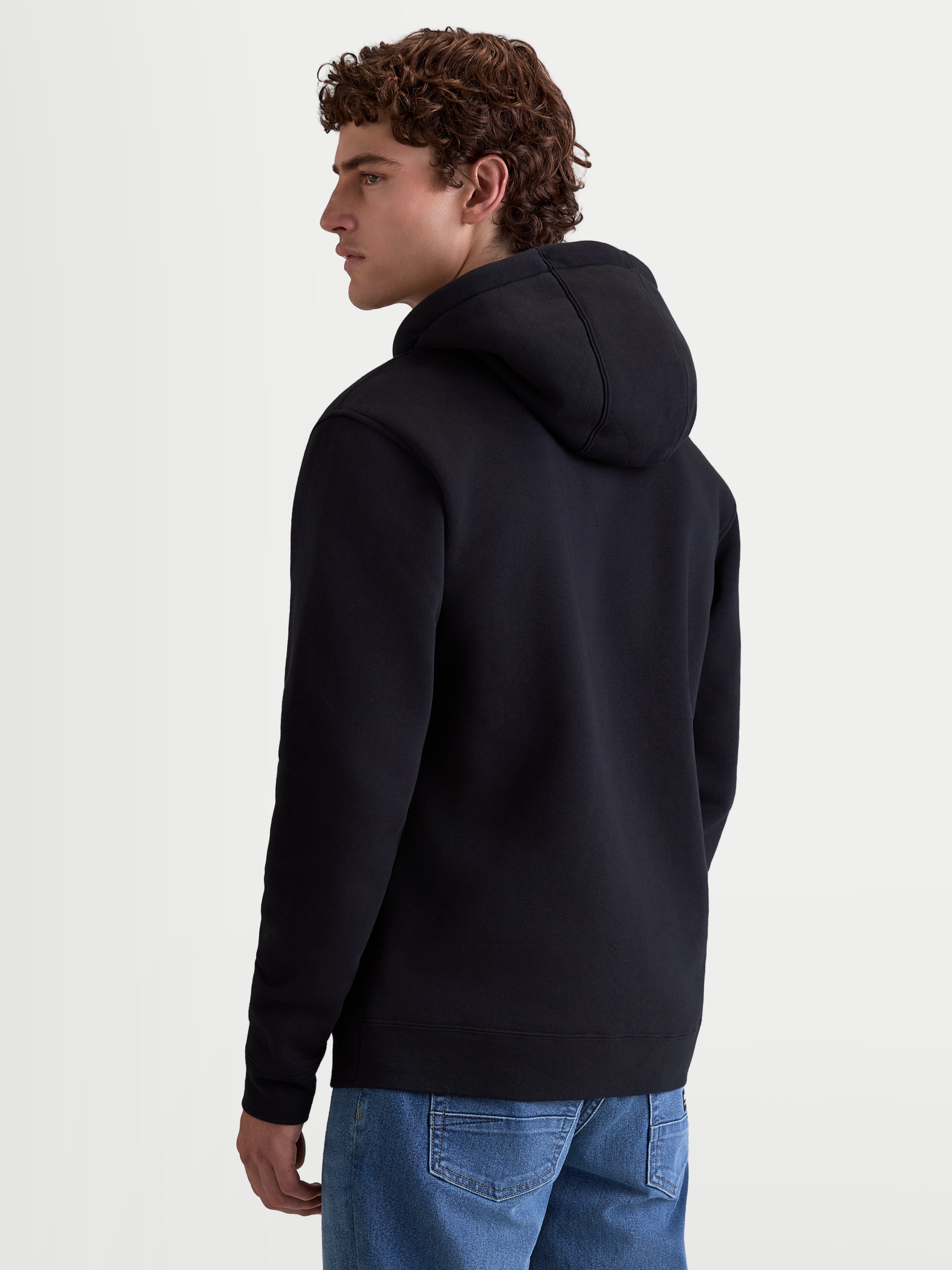 Alpinestars Felpa con cappuccio Ageless V3, pullover in pile sportswear da uomo, nera, vista posteriore con design con cappuccio e polsini a coste, in morbido misto cotone e poliestere riciclato, ideale per appassionati di motorsport.