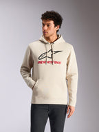 Alpinestars Always V3 Hoodie, abbigliamento sportivo casual, bianco sporco con logo a stella nero e marchio rosso, cappuccio con cordino, tasca a marsupio frontale, indossata da un modello con pantaloni scuri, design moderno ispirato al motorsport