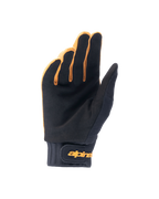 Guanti Alpinestars A-Dura, guanti da mountain bike, oro scuro e nero, vista del palmo in camoscio sintetico, polsino in neoprene con chiusura a strappo color oro, progettati per grip e mobilità in bicicletta.