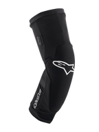 Ginocchiere Alpinestars Paragon Plus, nero e bianco, protezione per mountain bike MTB, manica in mesh traspirante slip-on, design ergonomico curvo con logo a stella bianco, costruzione imbottita per guida fuoristrada