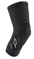 Alpinestars Paragon Lite Knee Protector, nero, protezione leggera con struttura in mesh traforata, logo bianco, linee di design grigie, design a manica slip-on, con etichette CE Livello 1 e Polygiene, progettata per MTB e ciclismo off-road